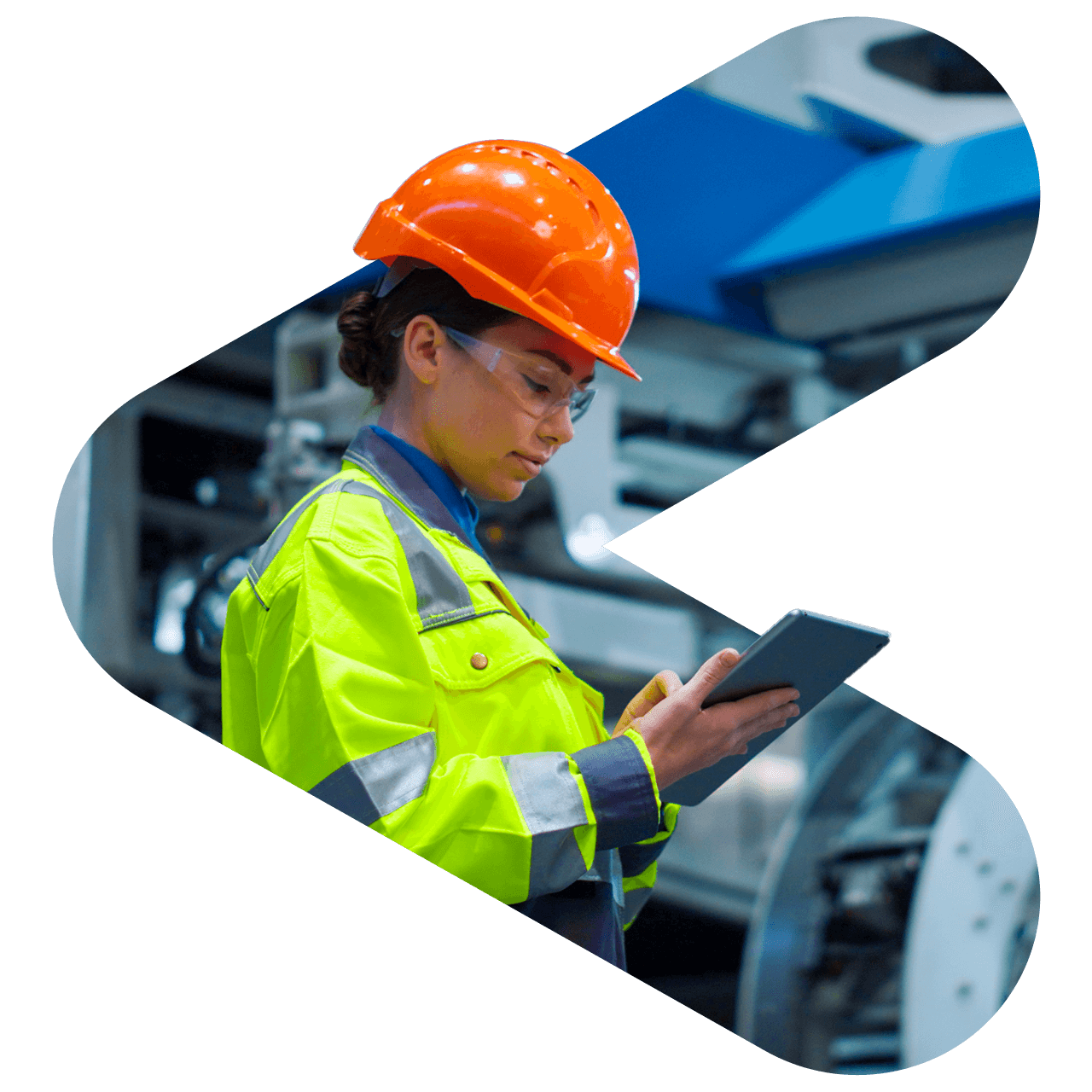 Mechanical engineer at a factory looking at her tablet