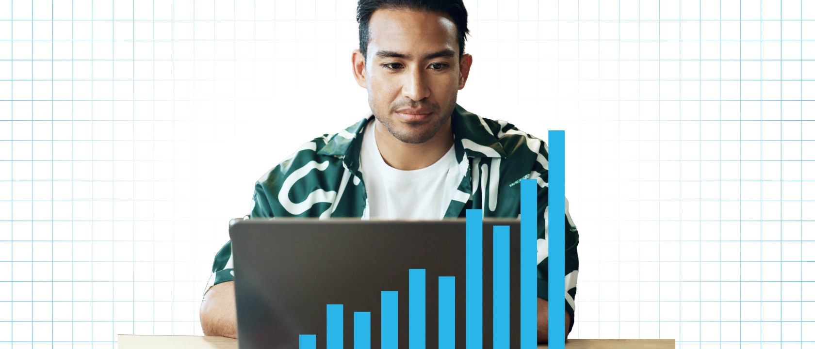 Photo illustration of a man using a laptop with a blue bar chart of rising bars superimposed over 