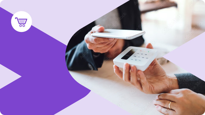 Man holding his phone over a remote keypad help by a woman