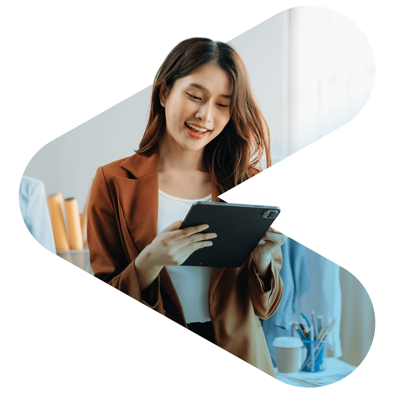 Woman smiling while using a tablet device