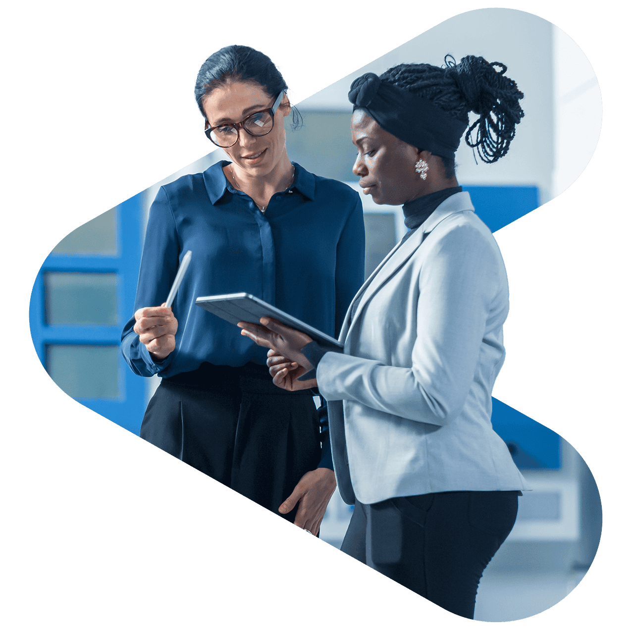 Two project leads standing and looking at a tablet