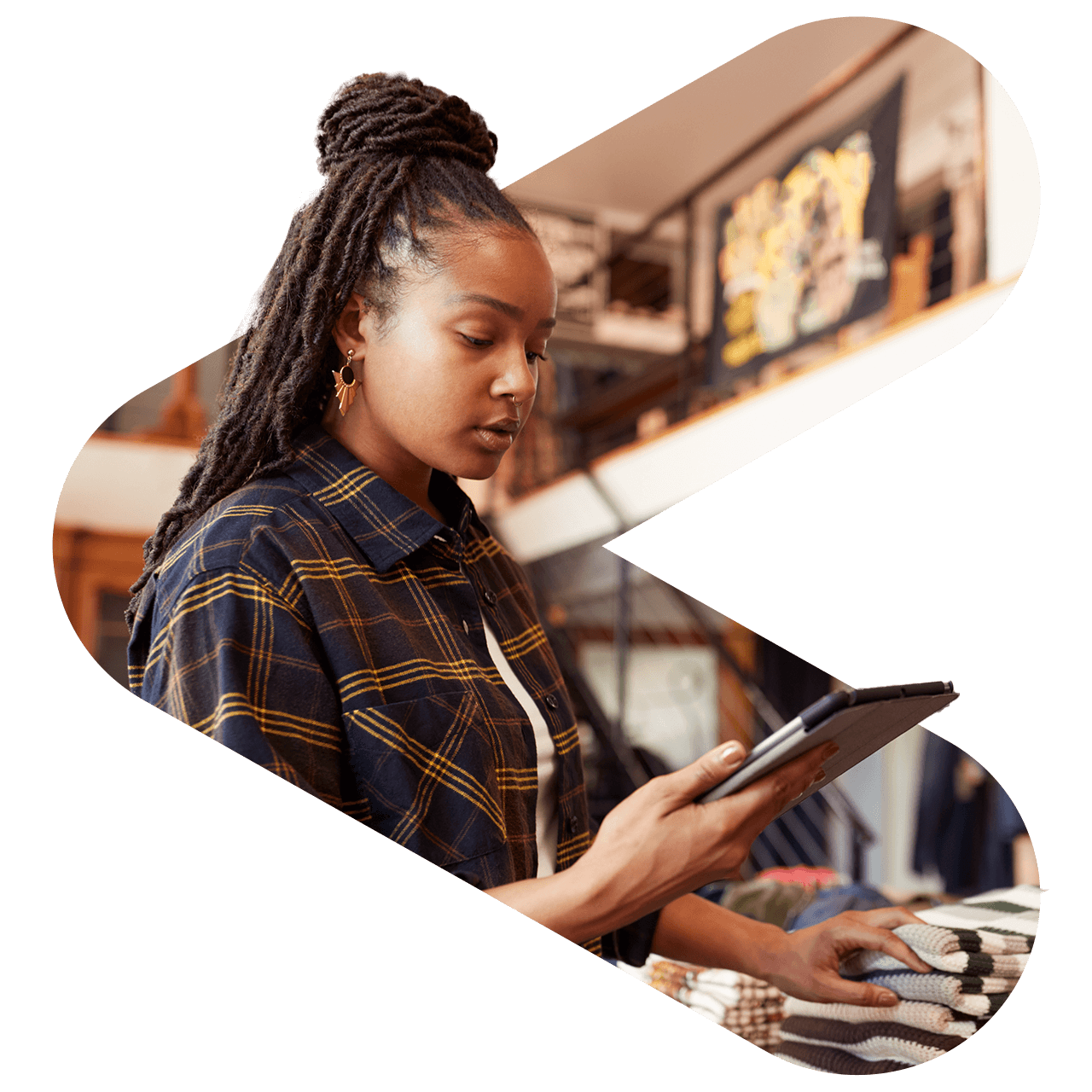 a woman working in a retail environment looking at a tablet